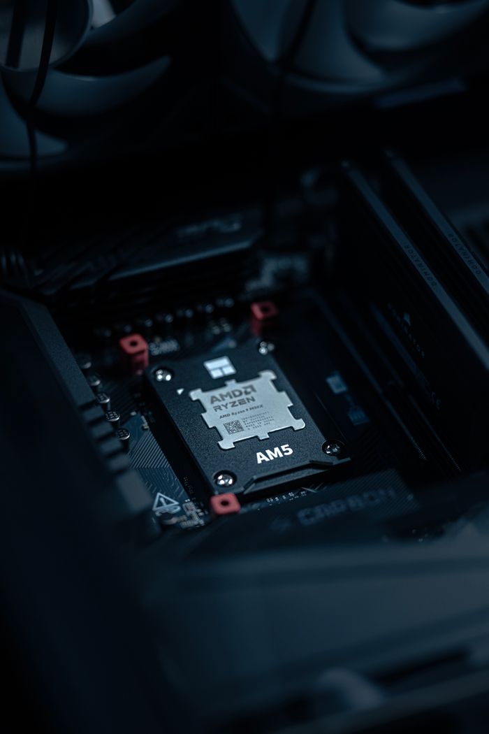 Detailed view of an AMD Ryzen processor securely placed on a motherboard, ideal for tech enthusiasts.